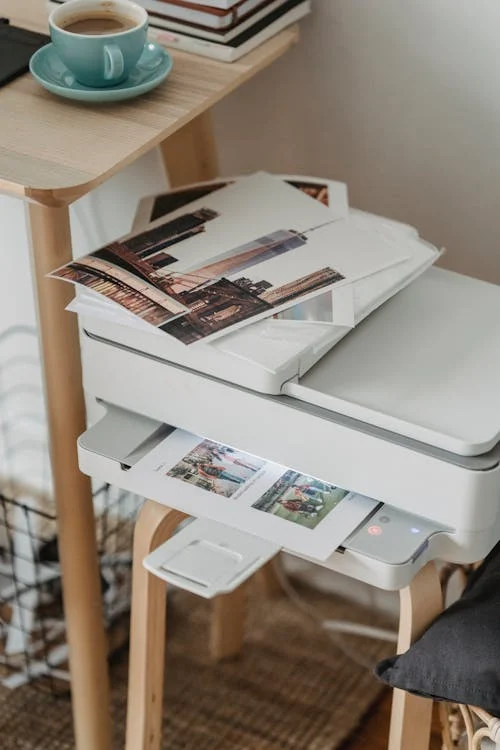 Business professional using Canon printer in modern office setting