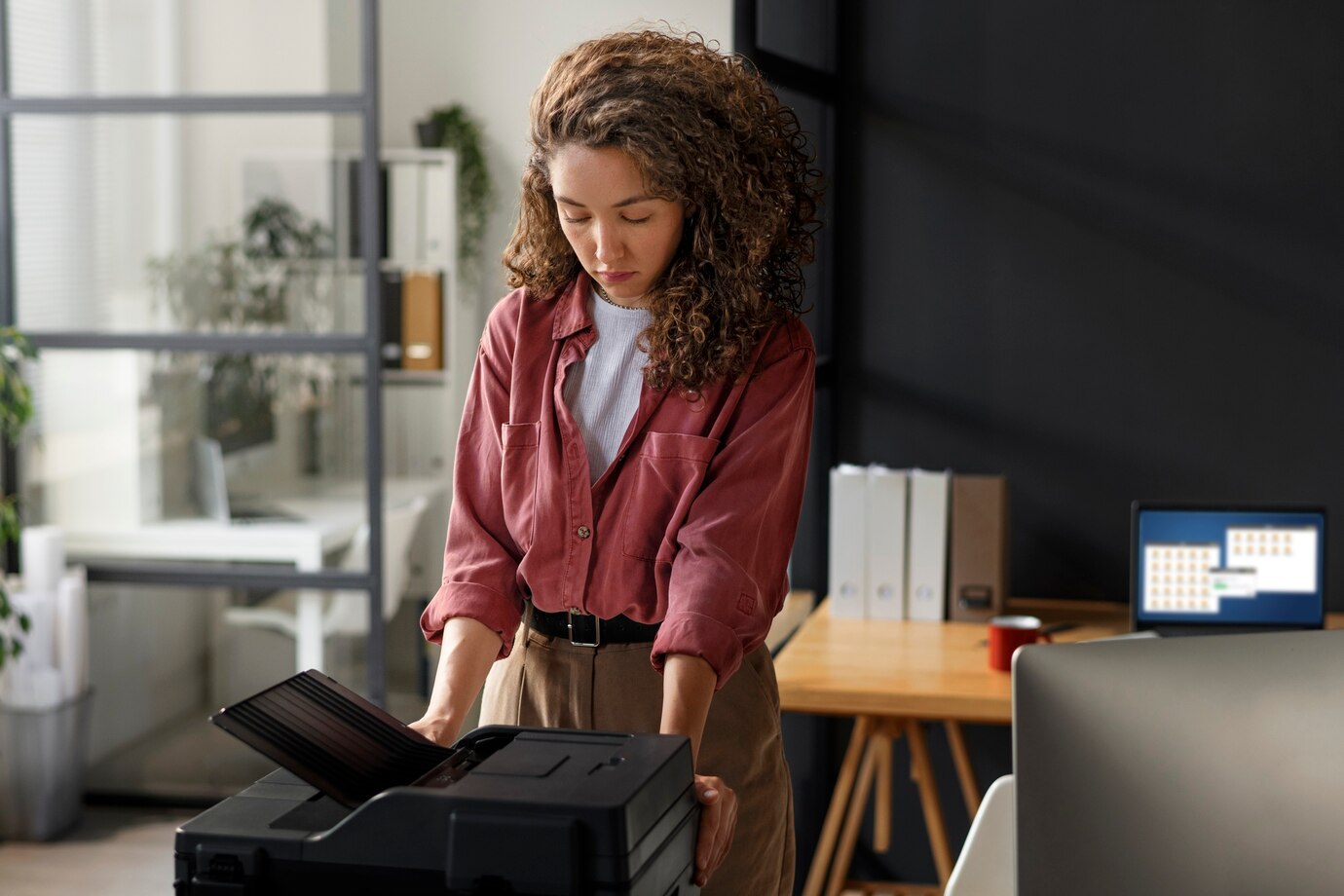 Woman using Canon printer in office